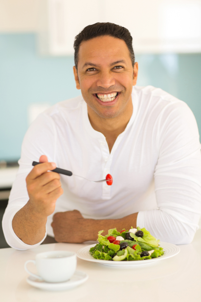 Man enjoying a healthy high-protein meal planned with the Unchecked Fitness AI meal planner app